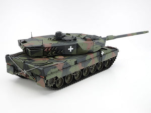 Camouflage tank model on a white background