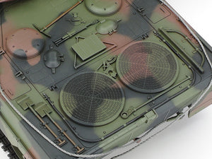 Close-up of a military vehicle model with detailed camouflage pattern