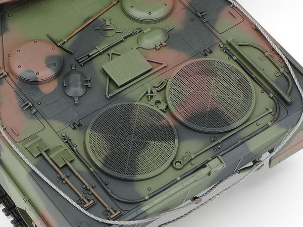 Close-up of a military vehicle model with detailed camouflage pattern
