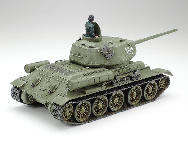 Model tank with a figure on top against a white background