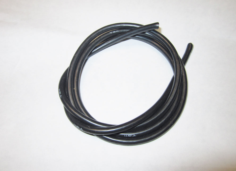 Coiled black cable on a white background