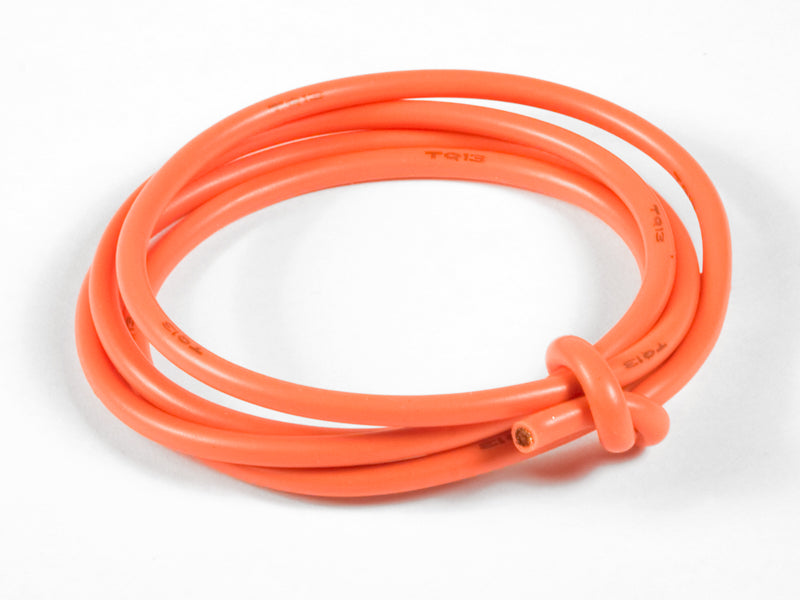Coiled orange cable on a white background