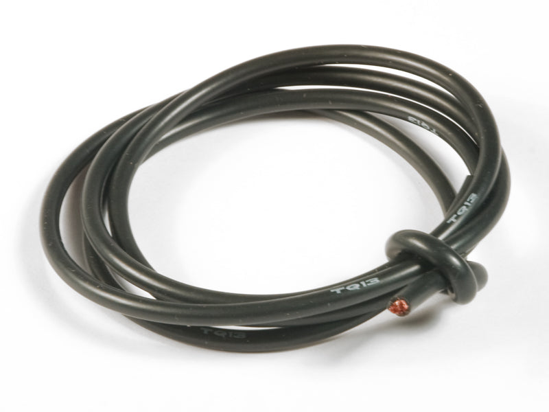 Coiled black cable on a white background