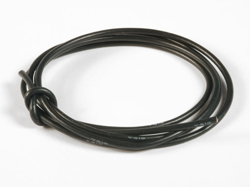 Coiled black cable on a white background