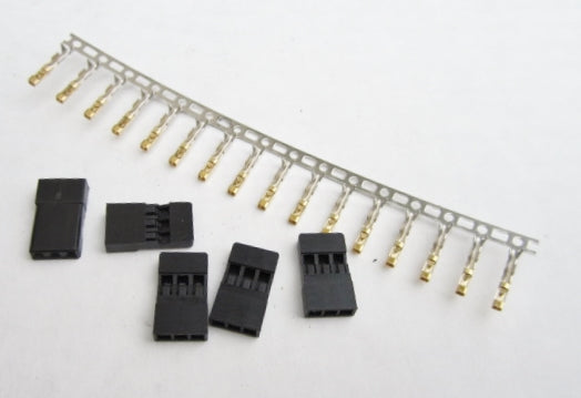 Set of black connectors with gold contacts on a white background