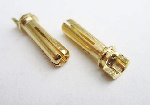 Two gold-colored metal connectors on a white background
