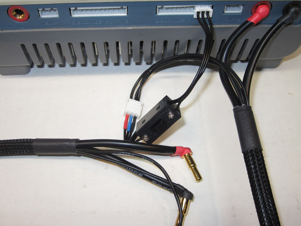 Electrical components with wires and connectors on a white surface