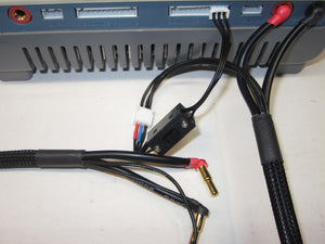 Electrical components with wires and connectors on a white surface