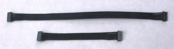 Two black computer cables on a white background
