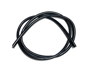 Coiled black rubber wire on a white background