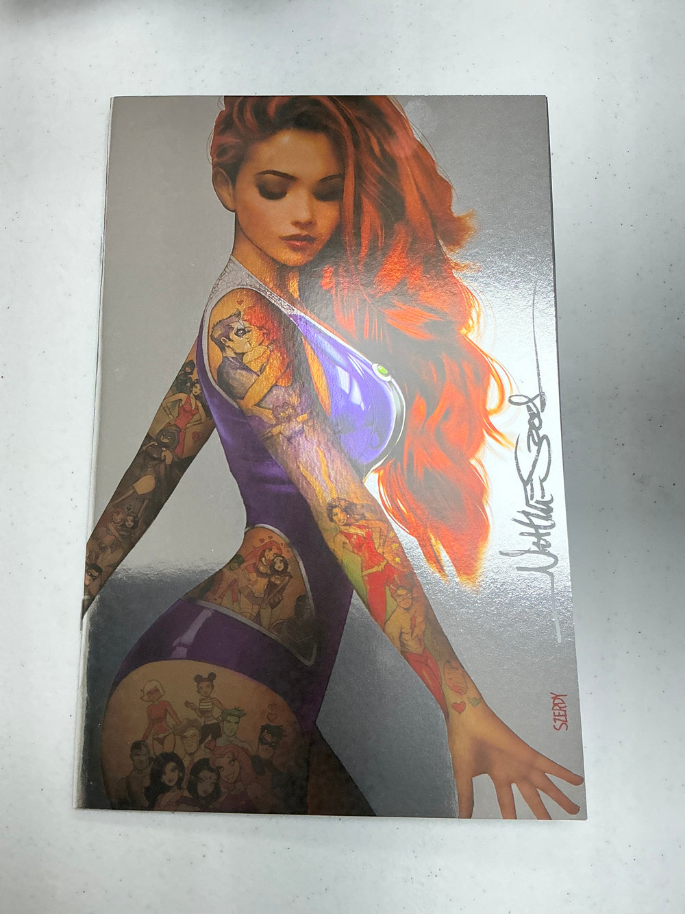 [Signed by Nathan Szerdy] [Foil] TITANS #1 NATHAN SZERDY TATTOO VIRGIN VAR [IN STOCK]