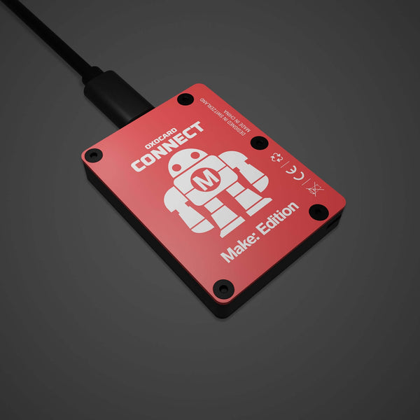 Red Oxocard Connect device labeled Make Edition with a robot icon, offering educational STEM learning and DIY capabilities for makers and builders, supporting family projects. Make: Getting Started with Oxocard Connect - PDF