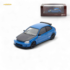 Blue model car with black roof and black wheels on a white background, displayed in front of its packaging.