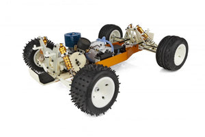 Model car chassis with wheels and mechanical components on a white background