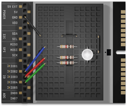 Close-up of a small electronic controller board featuring a clear LED, resistors, and multicolored jumper wires, accompanying the guide Make: Getting Started with Oxocard Connect - PDF, supporting STEM learning and DIY electronics projects.