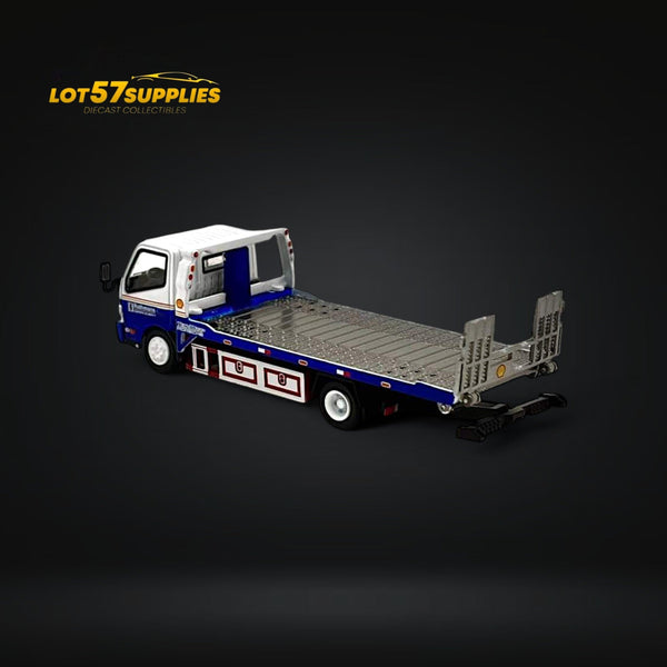 Model of a flatbed truck with 'LOT57SUPPLIES' logo on a dark background