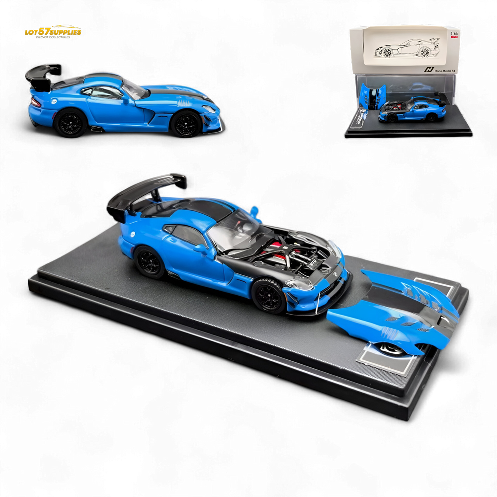 Blue sports car model on a display stand with additional car and packaging in the background.