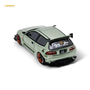 Model car with a large rear wing on a white background