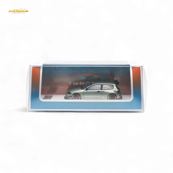 Model car in a transparent display case on a white background