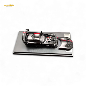 Model of a futuristic car on a display stand with 'LOTOS' branding.